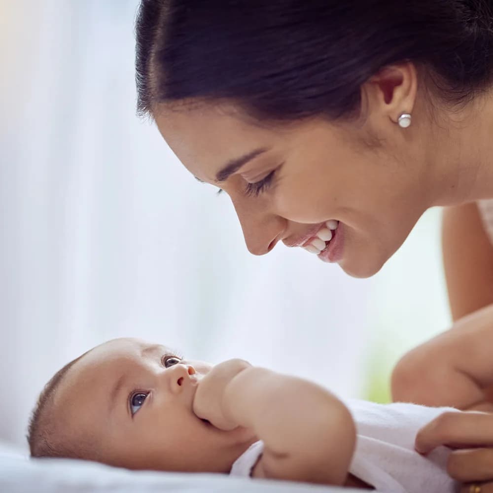 Mother smiling at her baby
