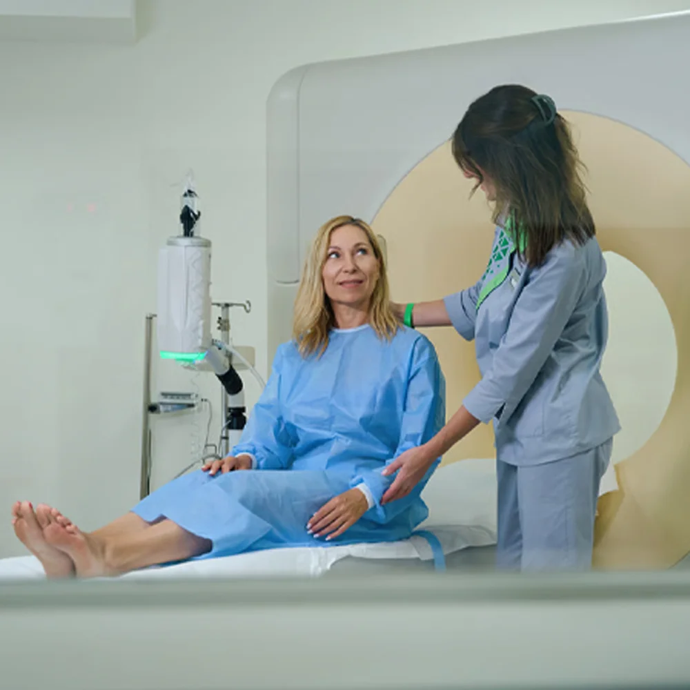 Patient being prepared for a pelvic MRI scan by a nurse