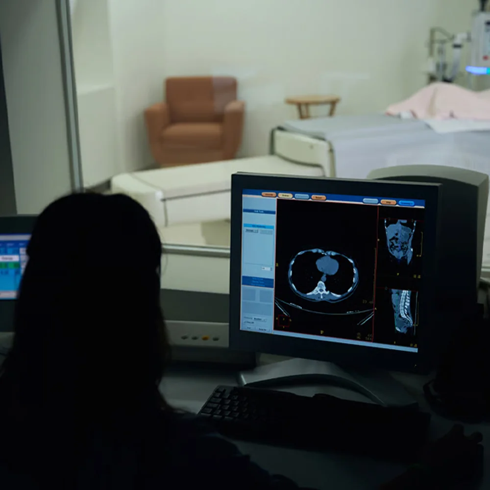 Radiologist reviewing pelvic MRI scan images