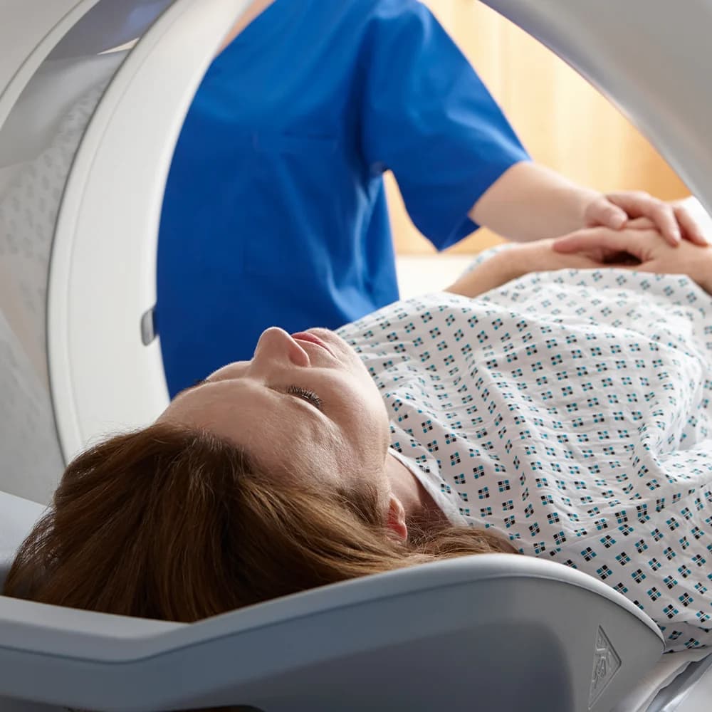 Patient undergoing a MRI scan in a scanner