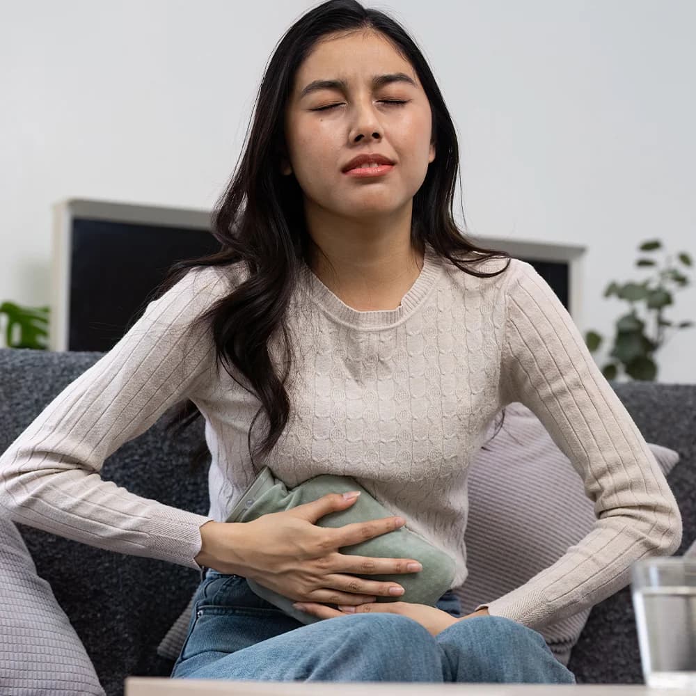 Woman experiencing lower abdominal pain