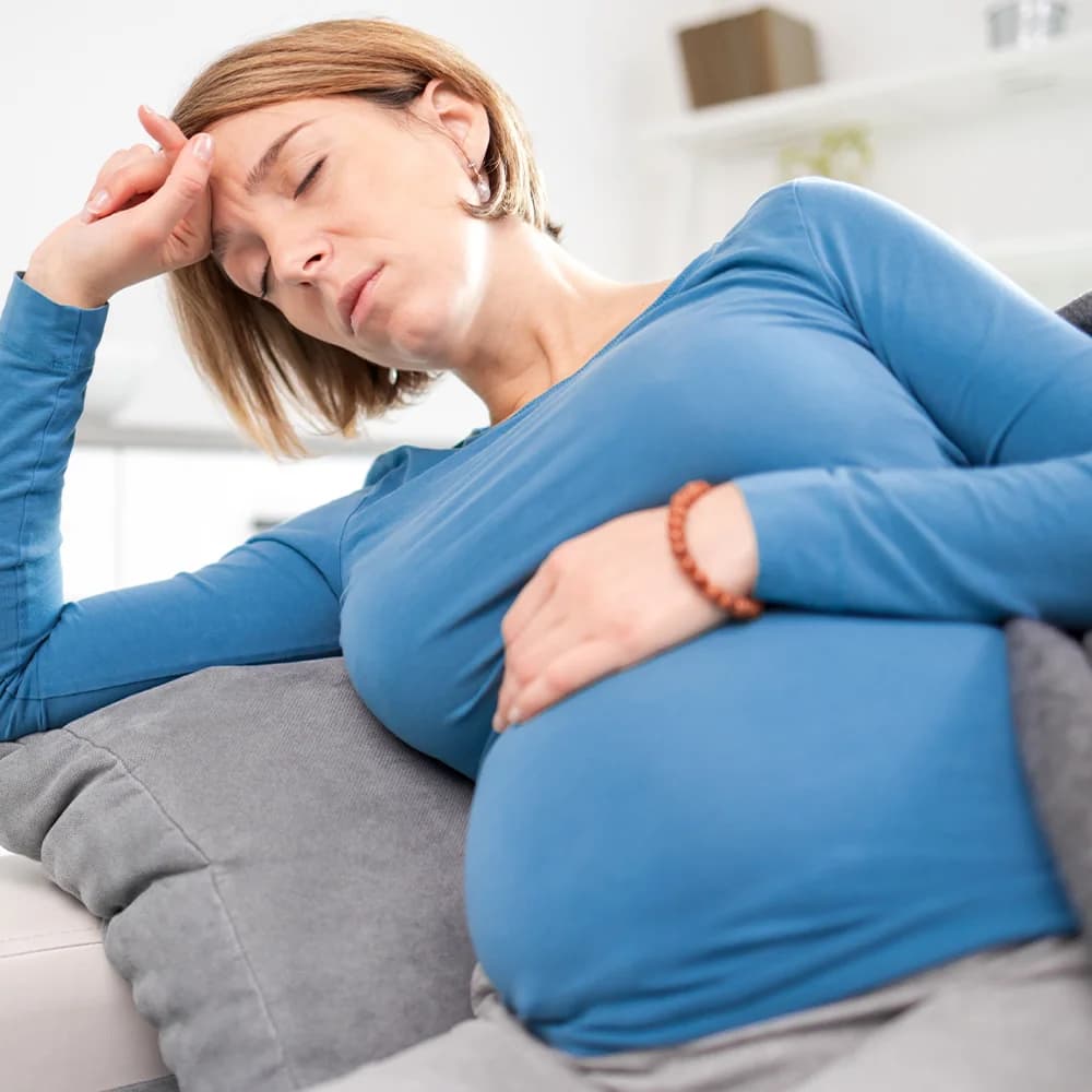 Pregnant woman feeling unwell and tired