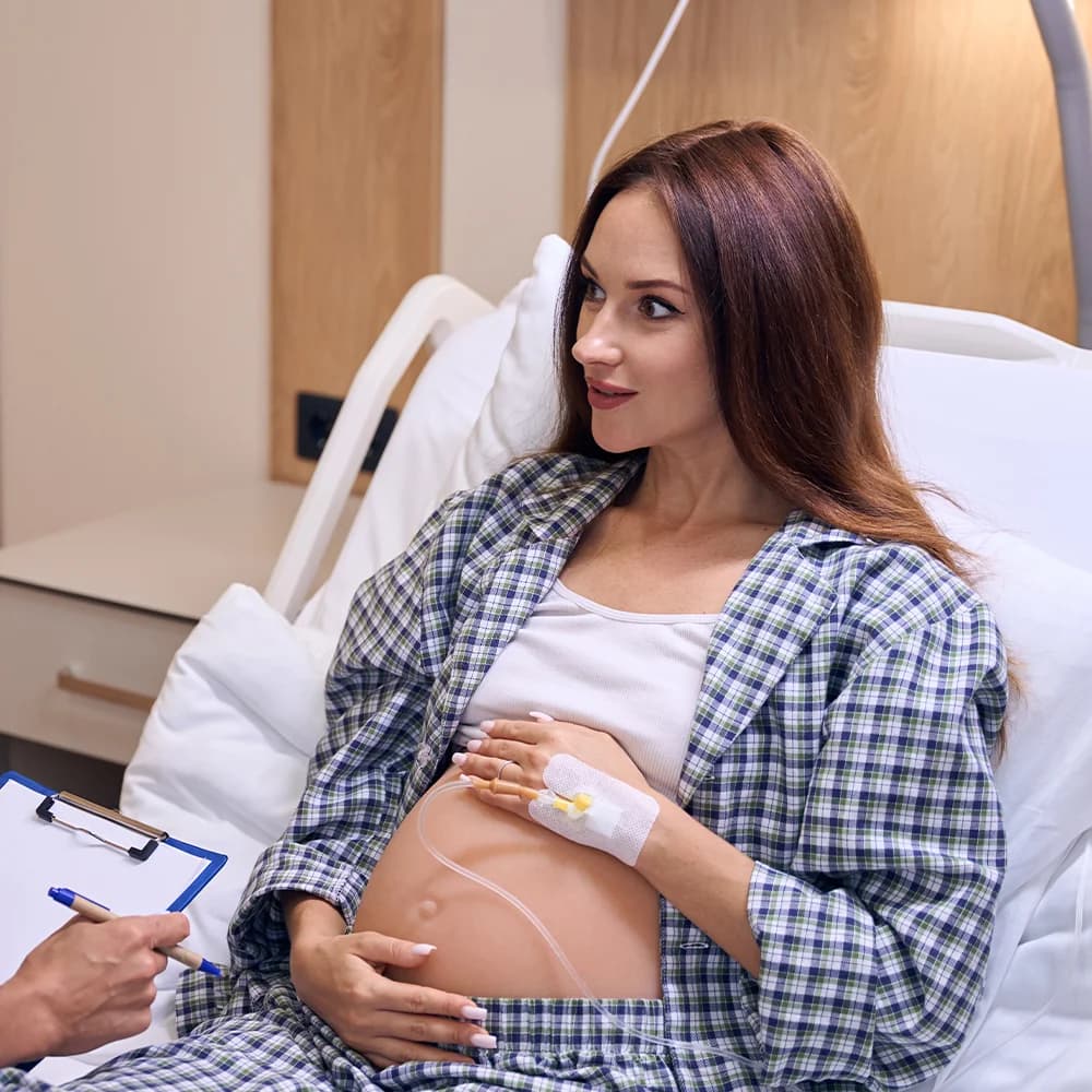 A Doctor reviewing a patient’s health after pregnancy