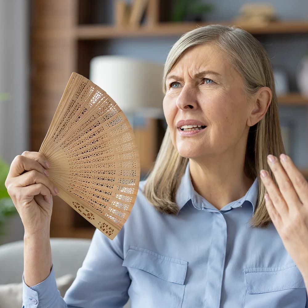 Woman affected by hot flushes and poor sleep