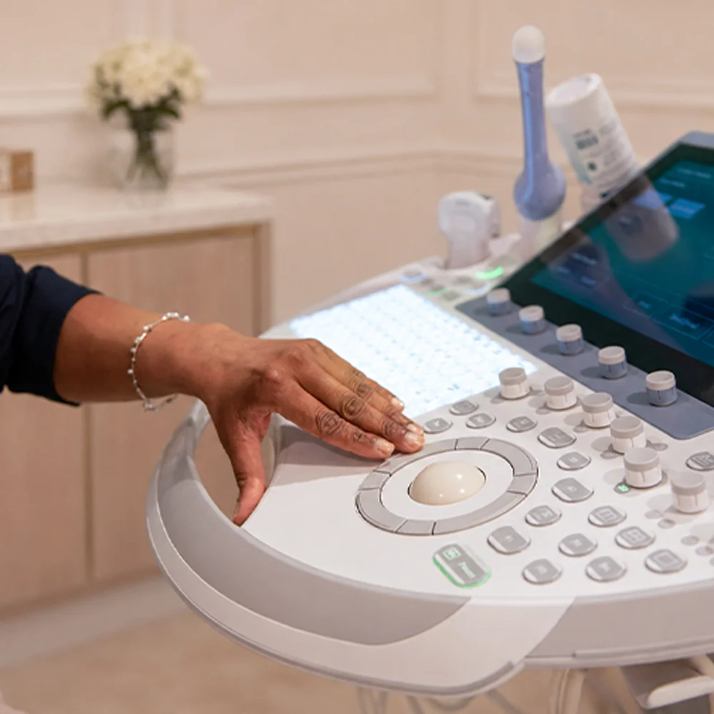 Consultant using an ultrasound machine