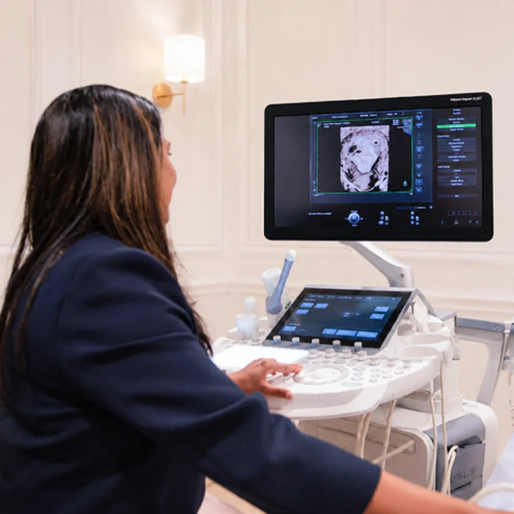 Dr Luxmi Velauthar reviewing scan results at ultrasound machine