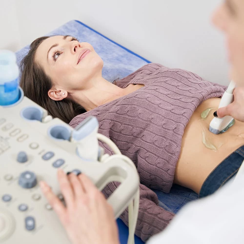 Consultant performing an ultrasound scan on a patient