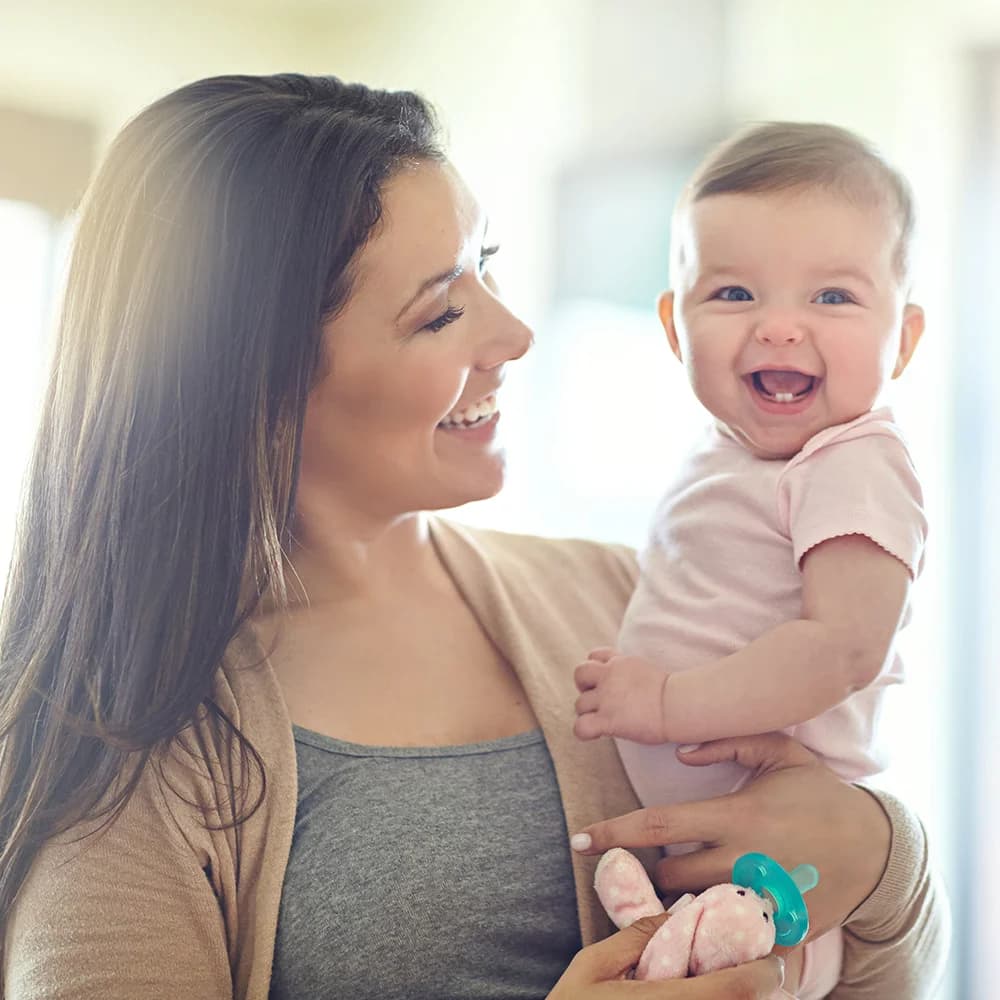 A mother holding her newborn baby