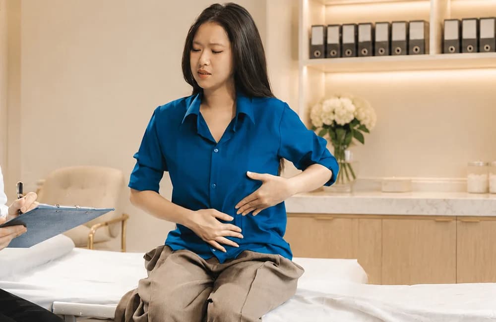 Woman resting with lower abdominal pain