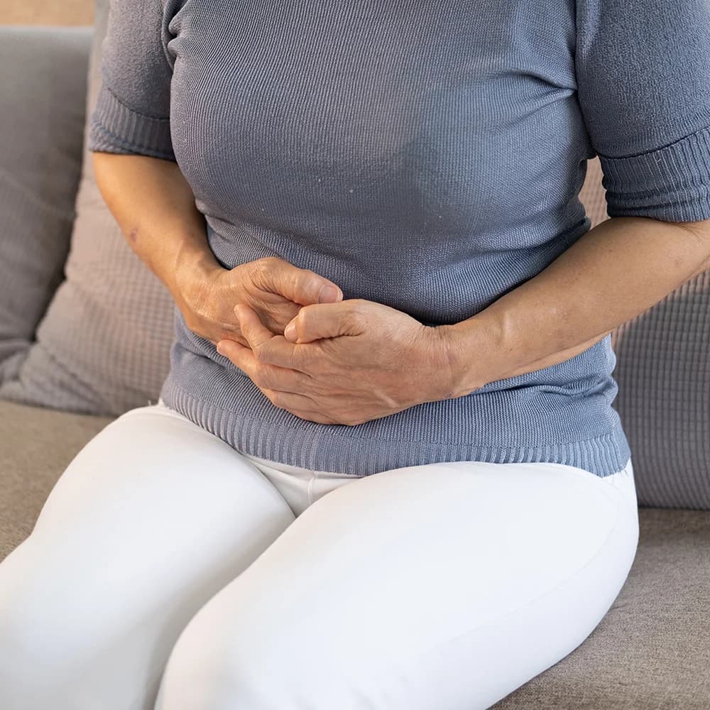 Woman seeking specialist advice for persistent symptoms