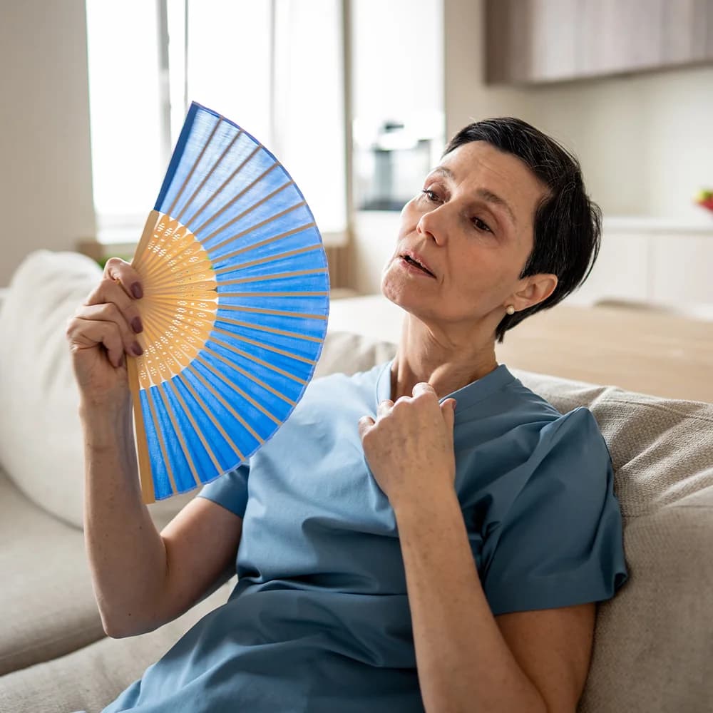 Woman experiencing menopausal symptoms