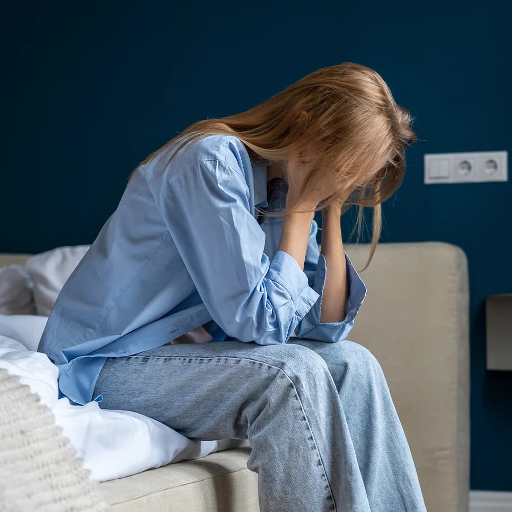 Woman affected by hot flushes and poor sleep
