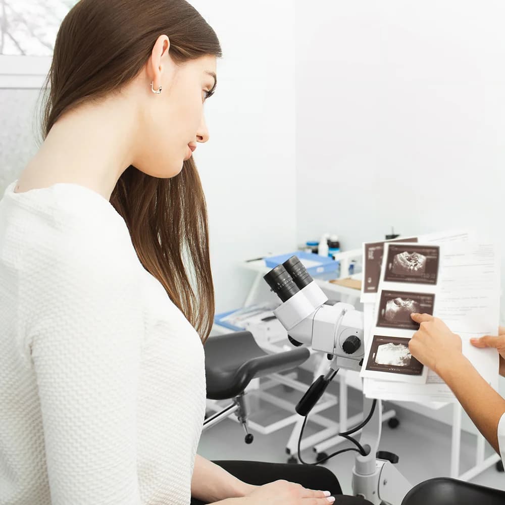 Doctor reviewing scan printouts with a patient