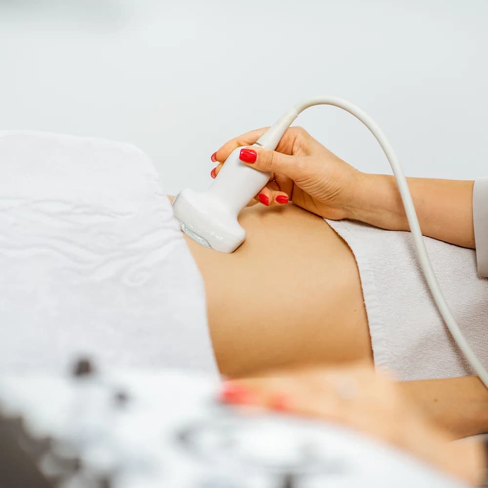 Consultant performing a pelvic ultrasound scan