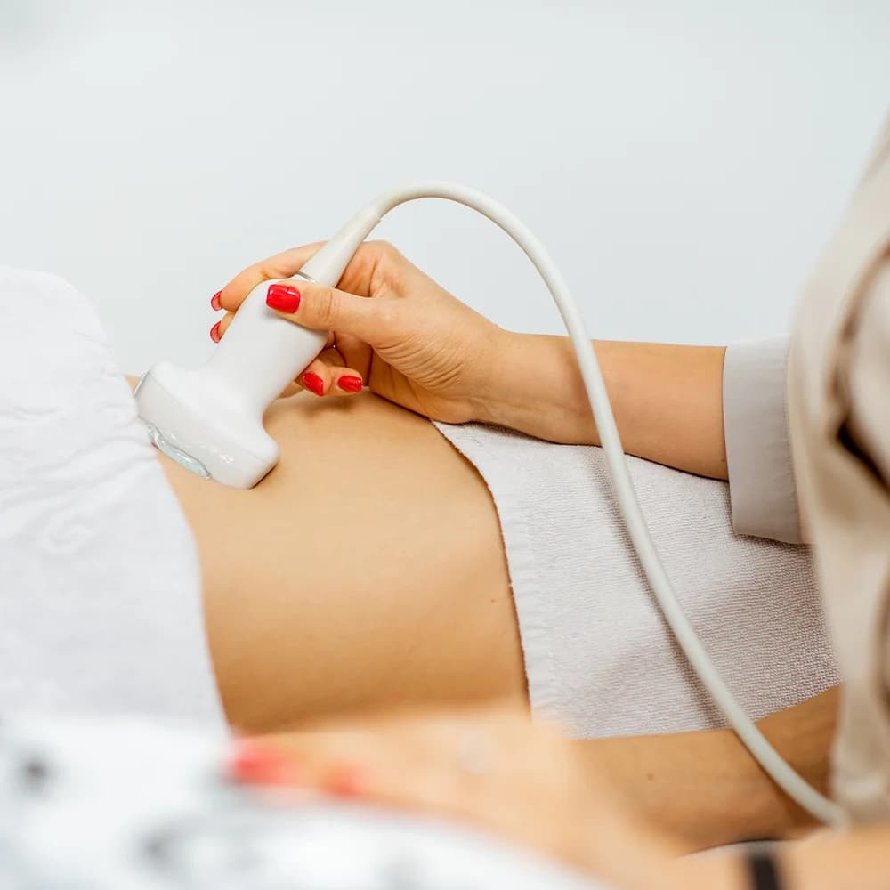 Consultant performing an ultrasound scan on a patient